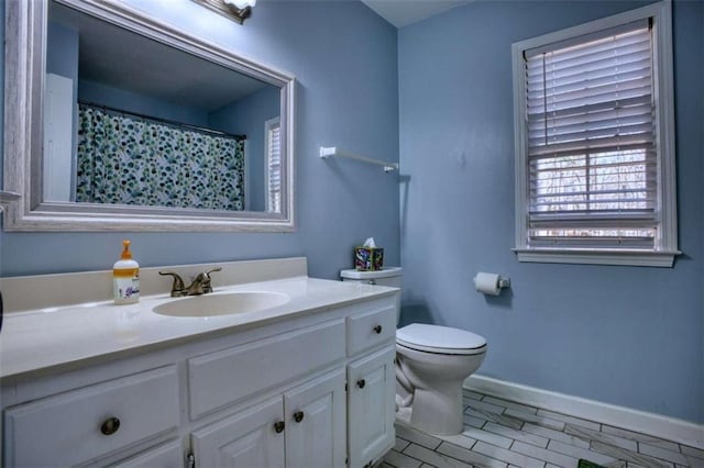 9600 Poplar Ct, Douglasville, GA 30135 - full bath featuring toilet, vanity, and baseboards