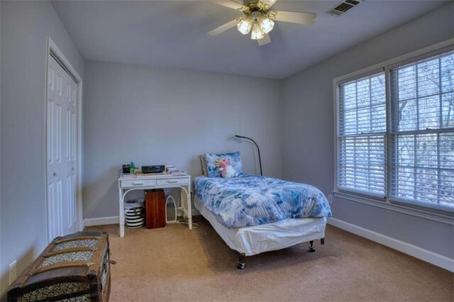 9600 Poplar Ct, Douglasville, GA 30135 - bedroom with carpet, baseboards, a closet, and ceiling fan