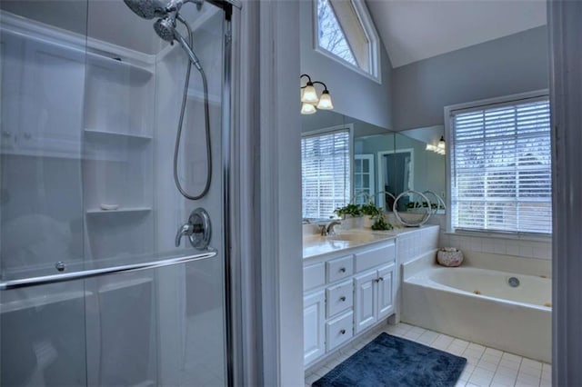 9600 Poplar Ct, Douglasville, GA 30135 - full bathroom with double vanity, a stall shower, tile patterned floors, healthy amount of natural light, and high vaulted ceiling