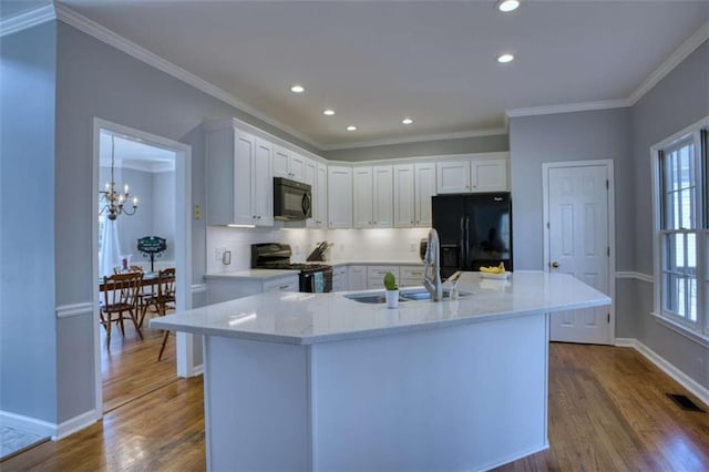 9600 Poplar Ct, Douglasville, GA 30135 - kitchen featuring black appliances, a sink, dark wood-style floors, tasteful backsplash, and white cabinets