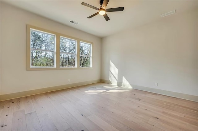 unfurnished room with ceiling fan and light wood-type flooring