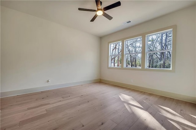 unfurnished room featuring ceiling fan and light hardwood / wood-style floors