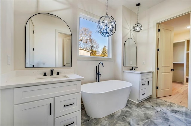 bathroom with vanity and a bathtub