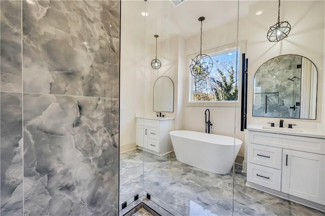 bathroom with vanity and a tub to relax in