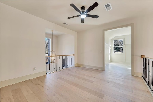 spare room with light hardwood / wood-style floors