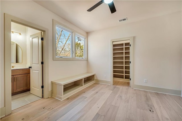 mudroom with ceiling fan and light wood-type flooring