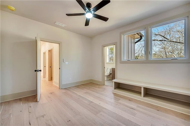 interior space with ceiling fan and light wood-type flooring
