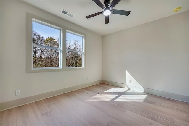 unfurnished room with ceiling fan and light hardwood / wood-style floors