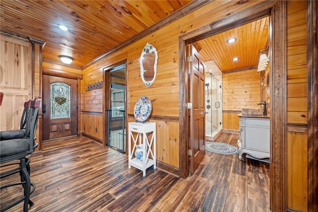 home office featuring dark hardwood / wood-style flooring, wood ceiling, and wooden walls