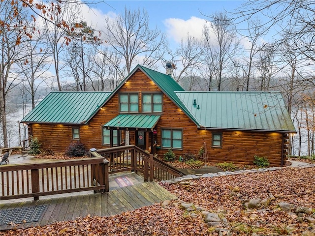 back of property featuring a wooden deck