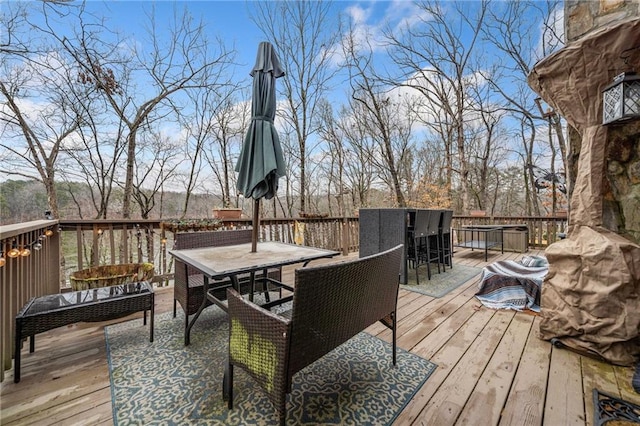 deck with an outdoor hangout area and an outdoor bar