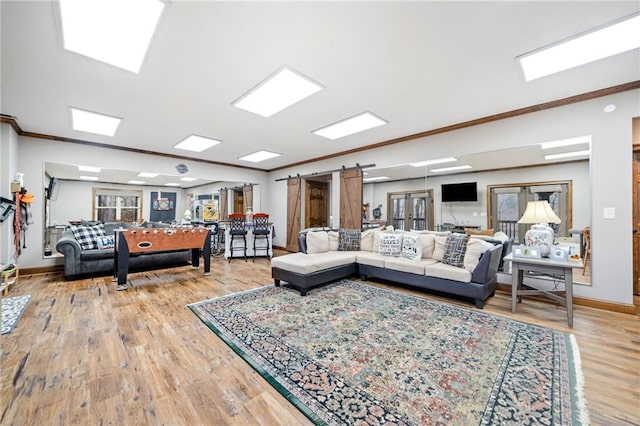 living room with hardwood / wood-style flooring and crown molding