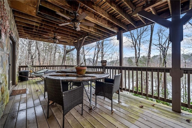 wooden terrace featuring ceiling fan