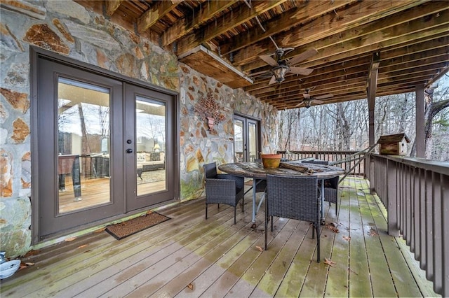 wooden terrace with french doors and ceiling fan