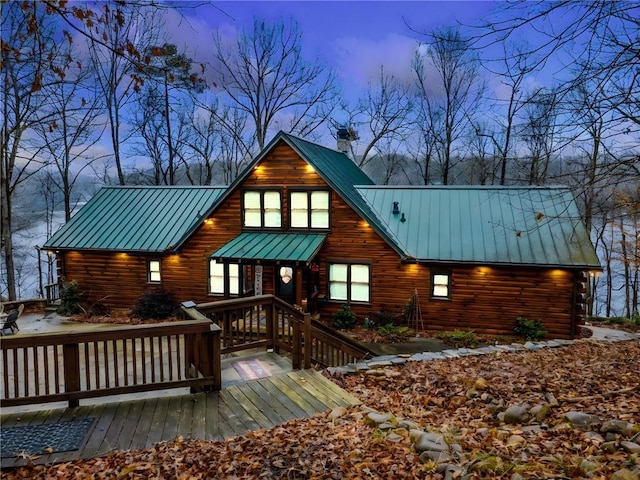 view of back house at dusk