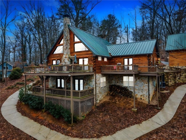 back of house with a wooden deck