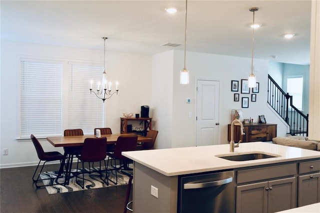 4734 Dewitt Dr, Duluth, GA 30097 - kitchen featuring stainless steel dishwasher, a sink, gray cabinetry, a chandelier, and dark wood-style floors