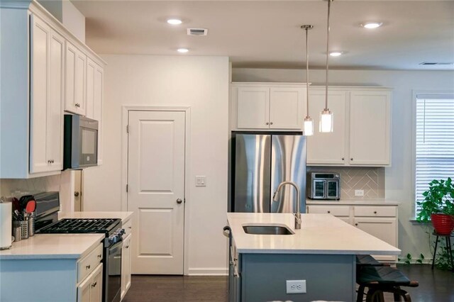 4734 Dewitt Dr, Duluth, GA 30097 - kitchen featuring stainless steel appliances, a sink, backsplash, light countertops, and recessed lighting
