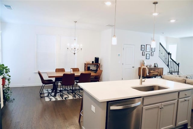 4734 Dewitt Dr, Duluth, GA 30097 - kitchen with stainless steel dishwasher, a sink, dark wood-style flooring, a chandelier, and recessed lighting