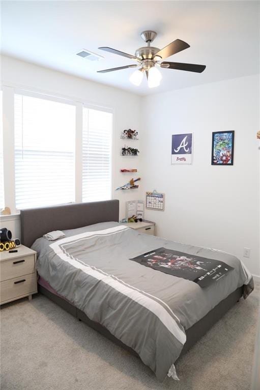 4734 Dewitt Dr, Duluth, GA 30097 - bedroom with multiple windows, light colored carpet, and ceiling fan