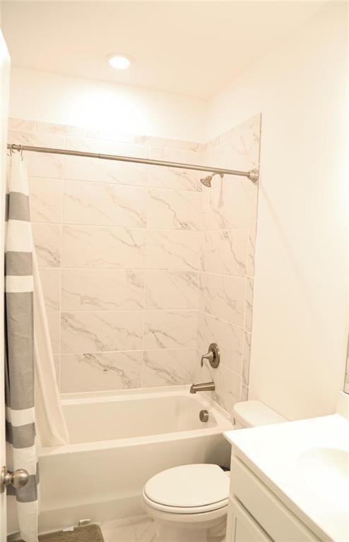 4734 Dewitt Dr, Duluth, GA 30097 - bathroom with shower / bath combo with shower curtain, toilet, vanity, and marble look tiles