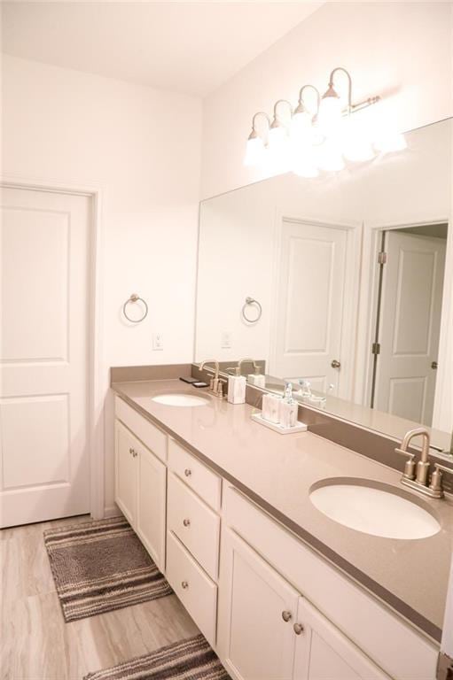 4734 Dewitt Dr, Duluth, GA 30097 - full bath featuring wood finished floors and double vanity