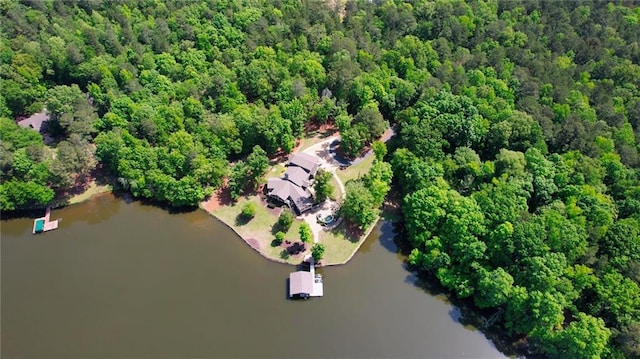 bird's eye view with a water view and a wooded view