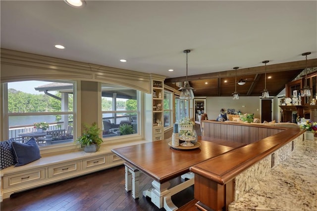 dining space with recessed lighting, dark wood finished floors, and lofted ceiling