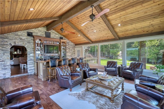 living room featuring wood ceiling, ceiling fan, arched walkways, lofted ceiling with beams, and wood-type flooring