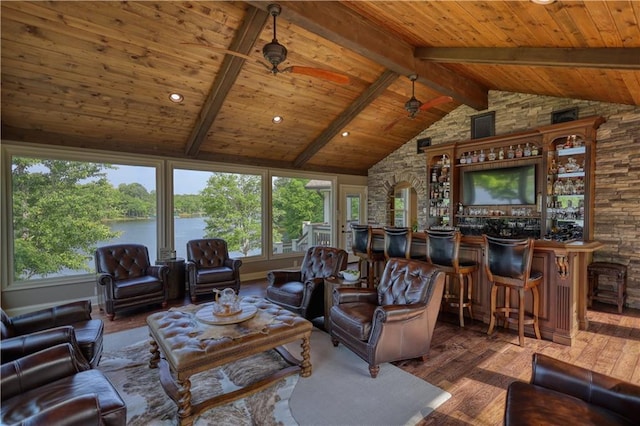 living room featuring vaulted ceiling with beams, wood finished floors, wooden ceiling, and indoor bar