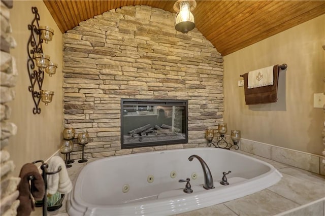 bathroom with a whirlpool tub, vaulted ceiling, and wooden ceiling