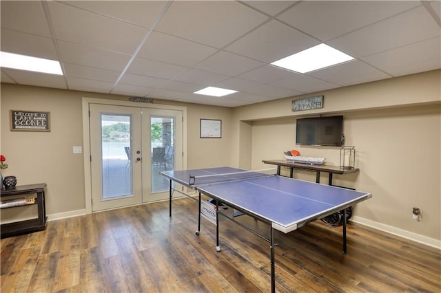 playroom featuring baseboards, french doors, and wood finished floors
