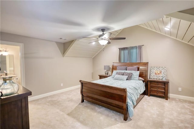 bedroom featuring ceiling fan, visible vents, vaulted ceiling, baseboards, and light carpet