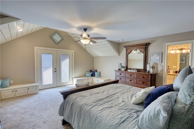 carpeted bedroom with access to outside, french doors, a ceiling fan, ensuite bathroom, and vaulted ceiling