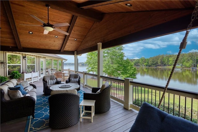 deck with an outdoor hangout area, a ceiling fan, and a water view