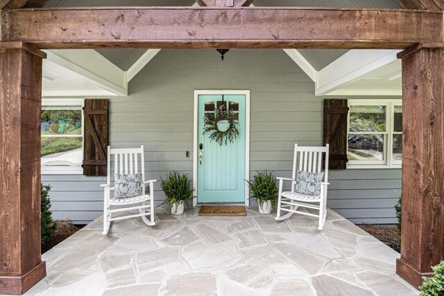 entrance to property with a porch