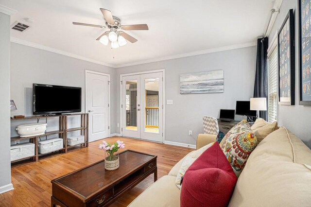 living room featuring ceiling fan, french doors, visible vents, wood finished floors, and baseboards