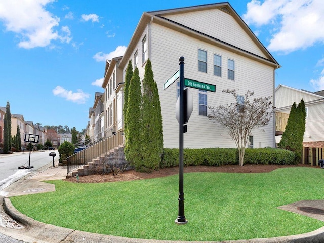 view of home's exterior featuring a yard