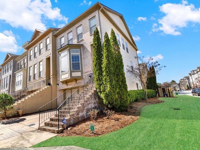 view of property exterior with a yard