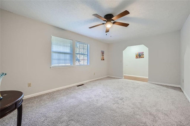 6118 Dana Ct, Lithonia, GA 30058 - carpeted spare room featuring ceiling fan, arched walkways, and a textured ceiling