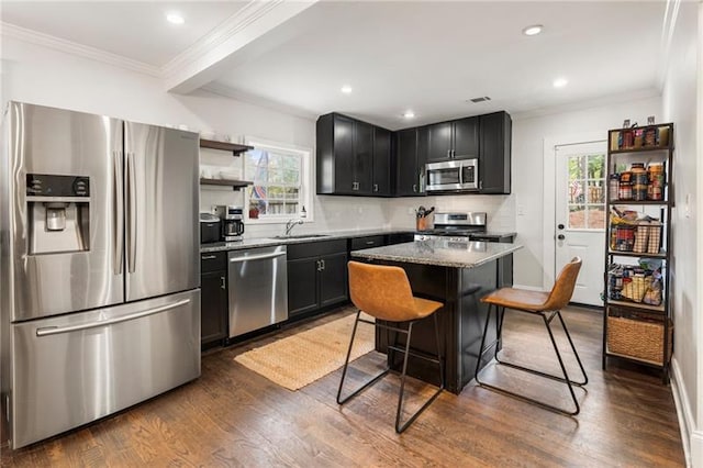 410 Wilkinson Dr SE, Atlanta, GA 30317 - kitchen with a wealth of natural light, appliances with stainless steel finishes, crown molding, and a sink