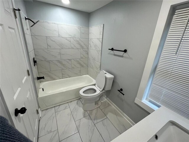 2040 Penelope St NW, Atlanta, GA 30314 - bathroom with marble finish floors, toilet, washtub / shower combination, and baseboards
