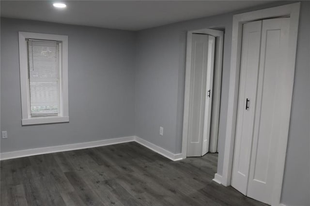 2040 Penelope St NW, Atlanta, GA 30314 - unfurnished bedroom with baseboards, dark wood-type flooring, and recessed lighting