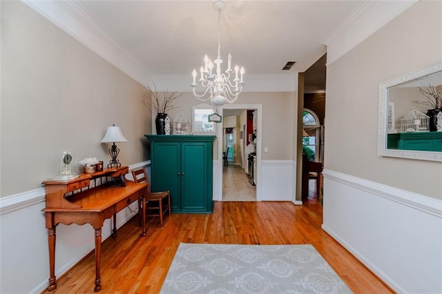 dining room with a fireplace, ceiling fan with notable chandelier, light hardwood / wood-style floors, and vaulted ceiling