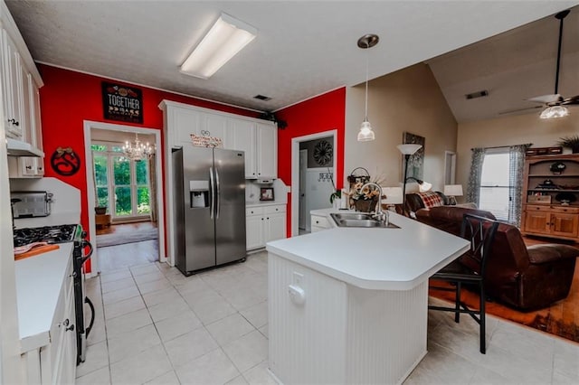 carpeted bedroom with multiple windows, connected bathroom, a tray ceiling, and ceiling fan