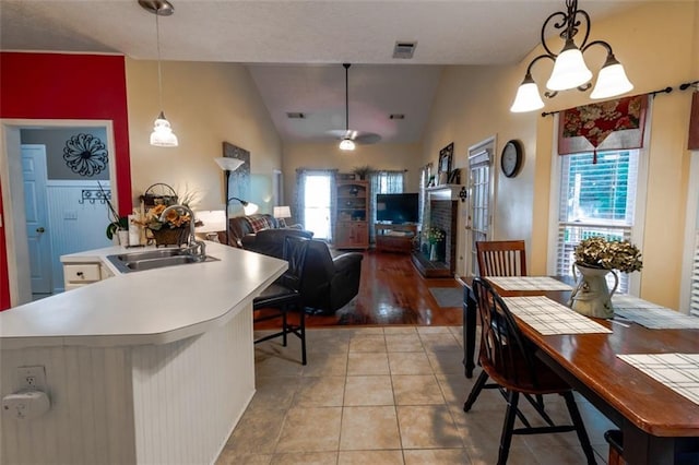 carpeted bedroom featuring a tray ceiling, ceiling fan, and crown molding