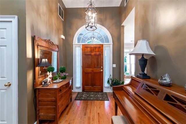 living room with hardwood / wood-style flooring, ceiling fan, lofted ceiling, and a fireplace