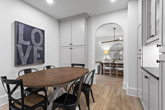 dining area with light hardwood / wood-style flooring