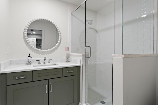 bathroom featuring vanity and an enclosed shower