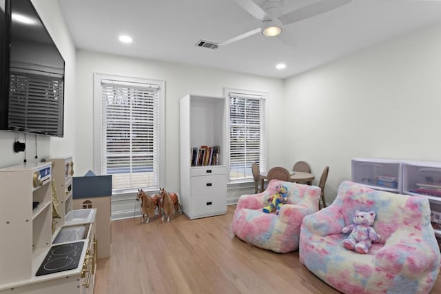 bedroom with ceiling fan and light hardwood / wood-style floors